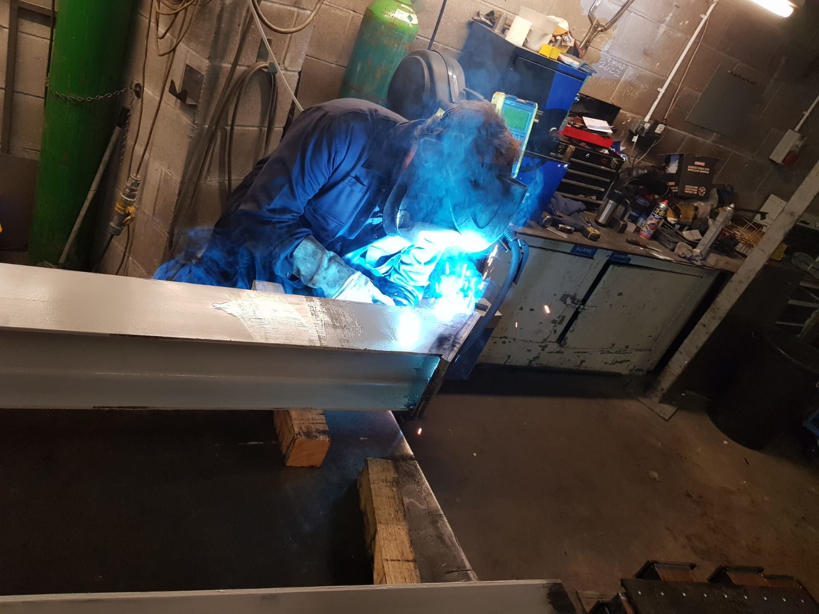 Image of CSM team member welding