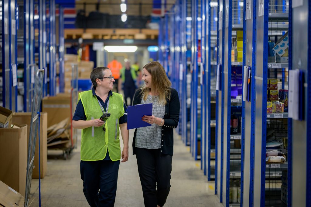 worker and client talking in a warehouse